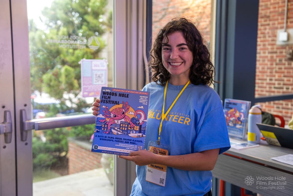 Woods Hole Film Festival Volunteer holding official program